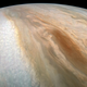 A long, oval-shaped “brown barge” on Jupiter—a transient cyclonic system.